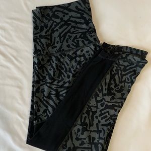 LULULEMON BLACK CHEETAH PRINT CROPPED LEGGINGS WITH SLIT BOTTOMS AND BLACK MESH